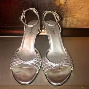 Silver, leather upper, ankle strap heels.
